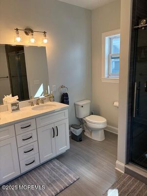 Bathroom, Dual Sink Vanities, Glass Shower, Interior, Wood Texture Flooring