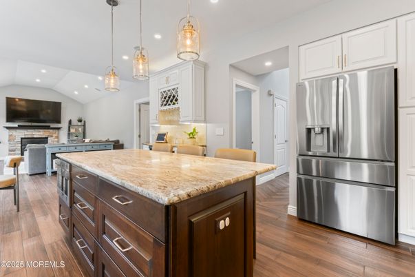 Fireplace, Interior, Kitchen, Pendant Lights, Recessed Lighting, Stainless Steel Appliances, Wood Texture Flooring
