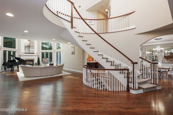 Chandelier, Dining room, Fireplace, Interior, Living room, Piano, Recessed Lighting, Wood Texture Flooring