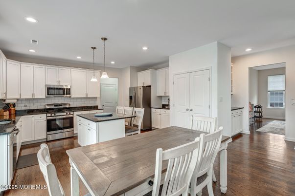 Dining room, Interior, Kitchen, Pendant Lights, Recessed Lighting, Stainless Steel Appliances, Wood Texture Flooring