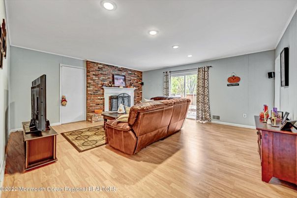 Fireplace, Interior, Living room, Recessed Lighting, Stone Walls, Wood Texture Flooring
