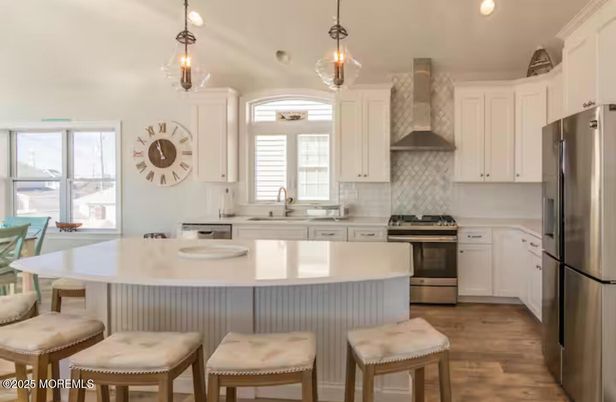 Dining room, Interior, Kitchen, Pendant Lights, Recessed Lighting, Stainless Steel Appliances, Wood Texture Flooring