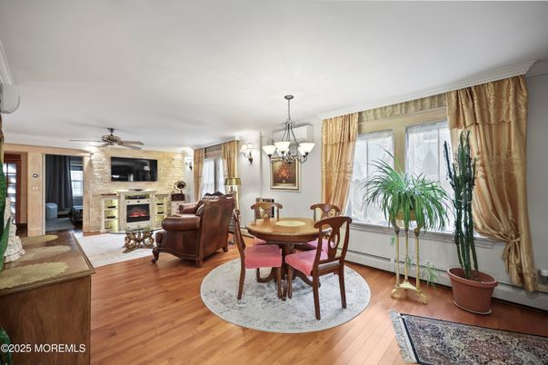 Chandelier, Dining room, Fireplace, Interior, Living room, Stone Walls, Wood Texture Flooring