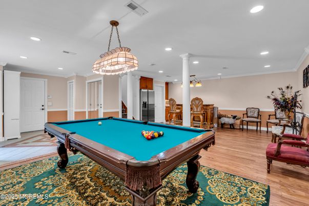 Billiard Table, Chandelier, Game Room, Interior, Pendant Lights, Recessed Lighting, Wood Texture Flooring