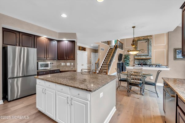 Dining room, Interior, Kitchen, Pendant Lights, Recessed Lighting, Stainless Steel Appliances, Wood Texture Flooring