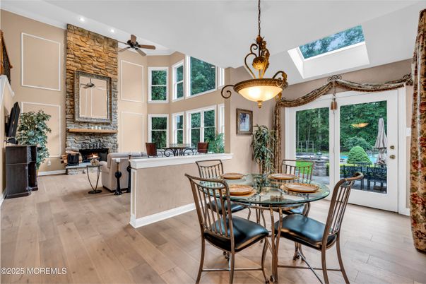 Dining room, Fireplace, Interior, Living room, Pendant Lights, Recessed Lighting, Wood Texture Flooring