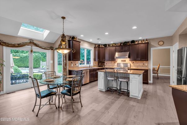 Dining room, Interior, Kitchen, Pendant Lights, Recessed Lighting, Stainless Steel Appliances, Wood Texture Flooring