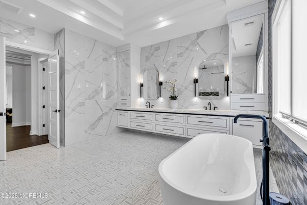 Bathroom, Dual Sink Vanities, Free Standing Baths, Interior, Marble Walls, Recessed Lighting, Wood Texture Flooring