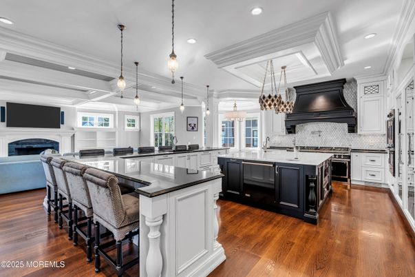 Chandelier, Fireplace, Interior, Kitchen, Pendant Lights, Recessed Lighting, Stainless Steel Appliances, Wood Texture Flooring