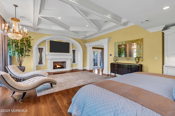 Bedroom, Chandelier, Fireplace, Interior, Recessed Lighting, Wood Texture Flooring