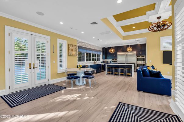Chandelier, Dining room, Interior, Kitchen, Living room, Pendant Lights, Recessed Lighting, Stainless Steel Appliances, Wood Texture Flooring