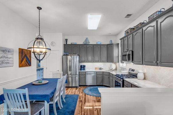 Dining room, Interior, Kitchen, Pendant Lights, Stainless Steel Appliances, Wood Texture Flooring