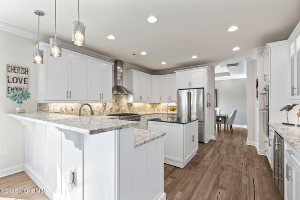 Dining room, Interior, Kitchen, Pendant Lights, Recessed Lighting, Stainless Steel Appliances, Wood Texture Flooring