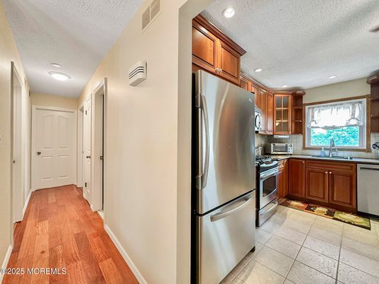 Interior, Kitchen, Recessed Lighting, Stainless Steel Appliances, Wood Texture Flooring