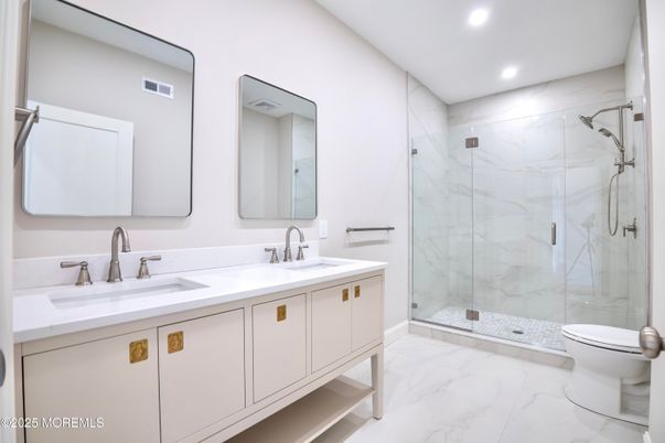 Bathroom, Dual Sink Vanities, Glass Shower, Interior, Marble, Marble Walls, Recessed Lighting
