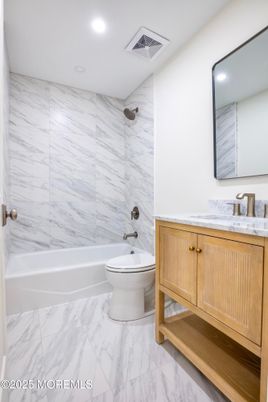 Bathroom, Dual Sink Vanities, Interior, Marble, Marble Walls, Recessed Lighting
