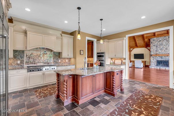 Fireplace, Interior, Kitchen, Pendant Lights, Recessed Lighting, Stainless Steel Appliances, Wooden Ceilings, Wood Texture Flooring
