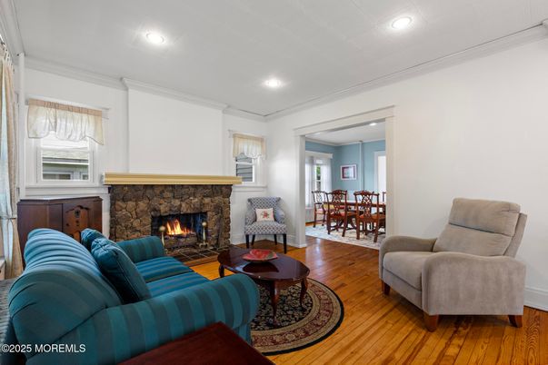 Dining room, Fireplace, Interior, Living room, Recessed Lighting, Wood Texture Flooring