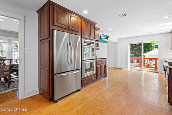 Dining room, Interior, Kitchen, Recessed Lighting, Stainless Steel Appliances, Wood Texture Flooring