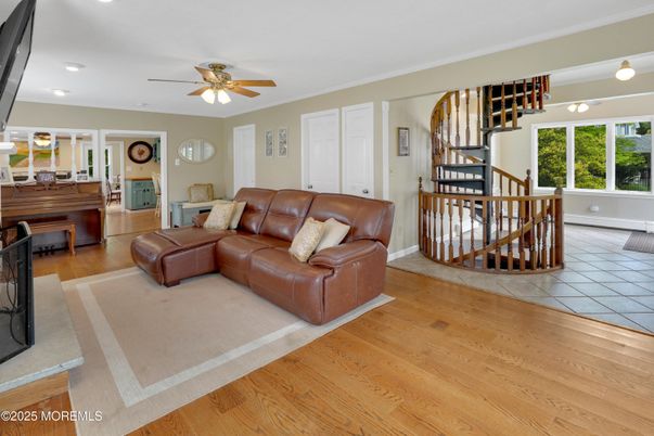Fireplace, Interior, Living room, Piano, Recessed Lighting, Wood Texture Flooring