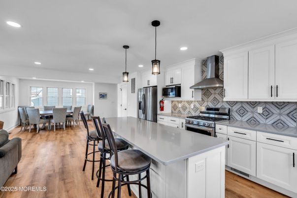 Dining room, Interior, Kitchen, Pendant Lights, Recessed Lighting, Stainless Steel Appliances, Wood Texture Flooring