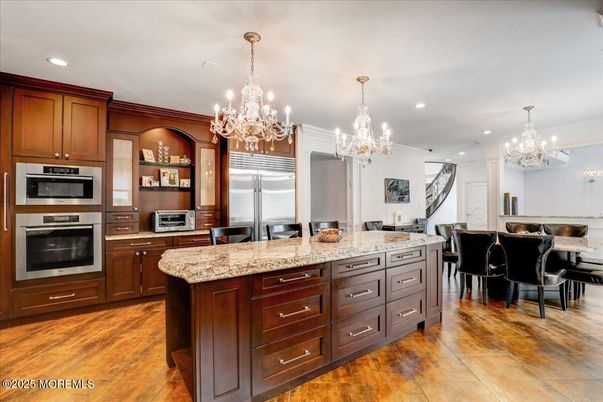 Chandelier, Dining room, Interior, Kitchen, Recessed Lighting, Stainless Steel Appliances, Wood Texture Flooring