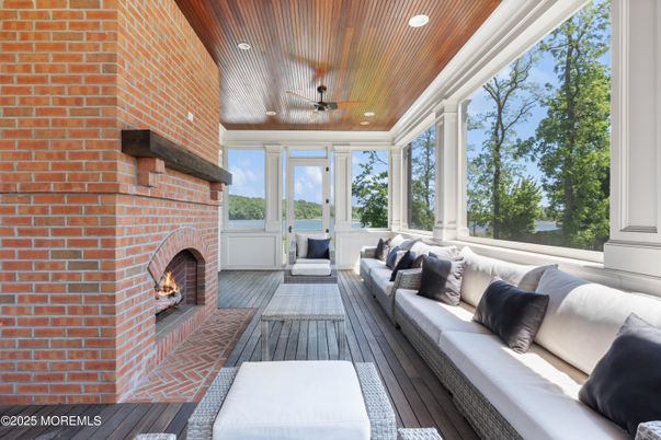 Fireplace, Interior, Living room, Recessed Lighting, Stone Walls, Sun Room, Wood Texture Flooring