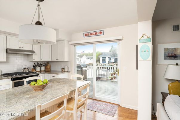 Dining room, Interior, Kitchen, Pendant Lights, Stainless Steel Appliances, Wood Texture Flooring