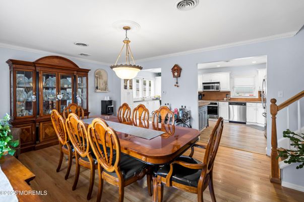 Dining room, Interior, Kitchen, Pendant Lights, Recessed Lighting, Stainless Steel Appliances, Wood Texture Flooring