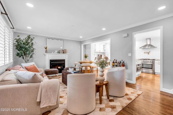Fireplace, Interior, Kitchen, Living room, Recessed Lighting, Stainless Steel Appliances, Wood Texture Flooring