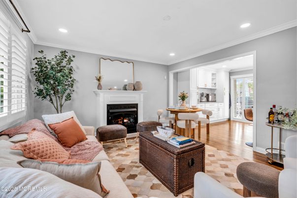 Dining room, Fireplace, Interior, Living room, Recessed Lighting, Wood Texture Flooring