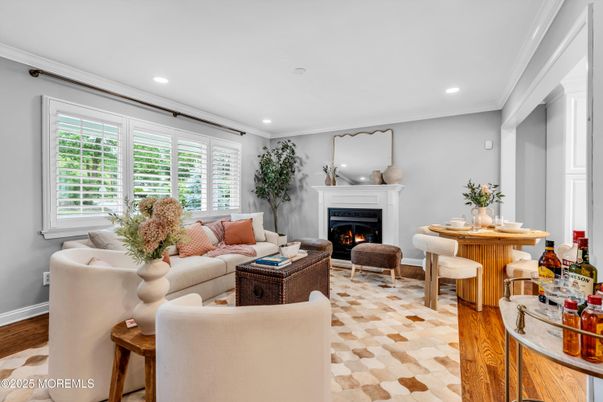 Dining room, Fireplace, Interior, Living room, Recessed Lighting, Wood Texture Flooring