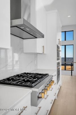Interior, Kitchen, Marble Walls, Recessed Lighting, Stainless Steel Appliances, Water, Wood Texture Flooring