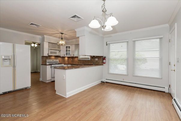 Chandelier, Empty room, Interior, Kitchen, Pendant Lights, Stainless Steel Appliances, Wood Texture Flooring