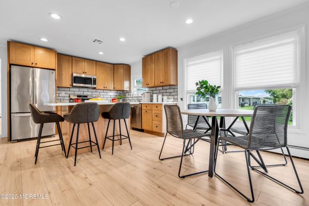 Dining room, Interior, Kitchen, Recessed Lighting, Stainless Steel Appliances, Wood Texture Flooring