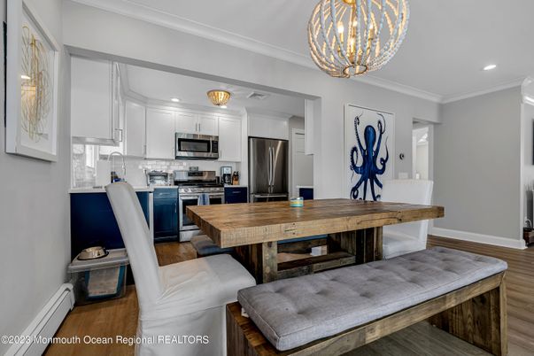 Chandelier, Dining room, Interior, Kitchen, Recessed Lighting, Stainless Steel Appliances, Wood Texture Flooring