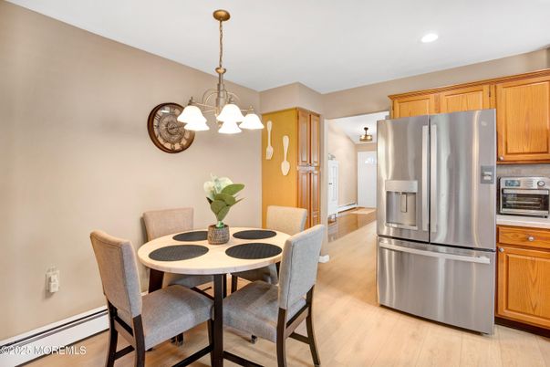 Chandelier, Dining room, Interior, Kitchen, Pendant Lights, Recessed Lighting, Stainless Steel Appliances, Wood Texture Flooring