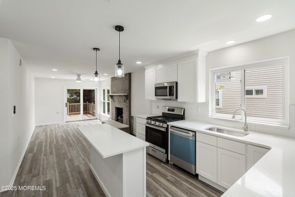 Fireplace, Interior, Kitchen, Pendant Lights, Recessed Lighting, Stainless Steel Appliances, Wood Texture Flooring
