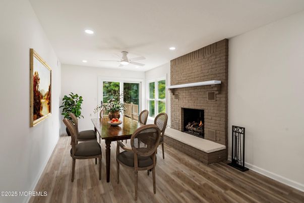 Dining room, Fireplace, Interior, Recessed Lighting, Stone Walls, Wood Texture Flooring