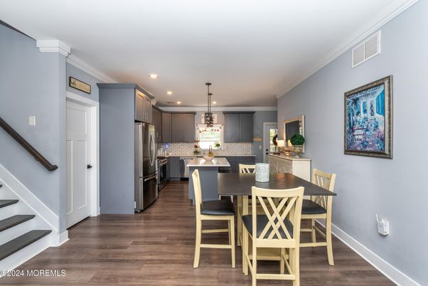 Dining room, Interior, Kitchen, Pendant Lights, Recessed Lighting, Stainless Steel Appliances, Wood Texture Flooring
