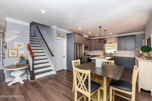Dining room, Interior, Kitchen, Pendant Lights, Recessed Lighting, Stainless Steel Appliances, Wood Texture Flooring
