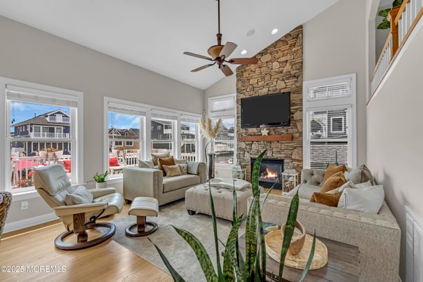 Fireplace, Interior, Living room, Recessed Lighting, Stone Walls, Wood Texture Flooring