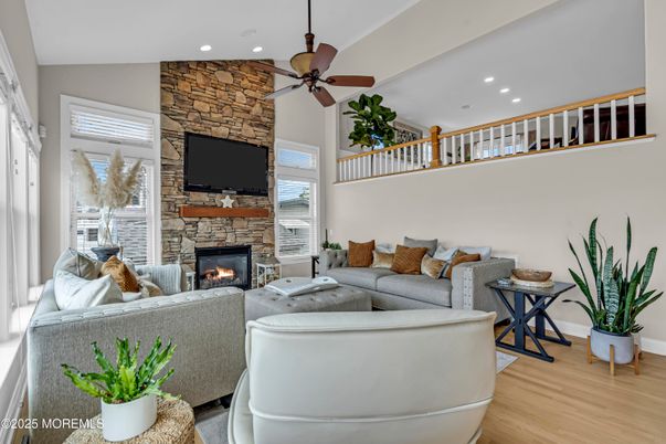 Fireplace, Interior, Living room, Recessed Lighting, Stone Walls, Wood Texture Flooring