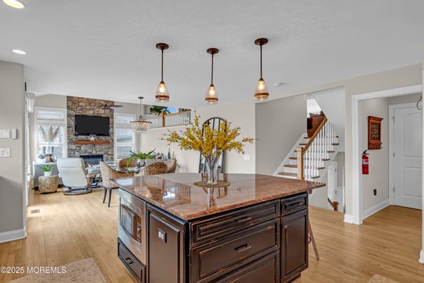 Dining room, Fireplace, Interior, Pendant Lights, Recessed Lighting, Stone Walls, Wood Texture Flooring
