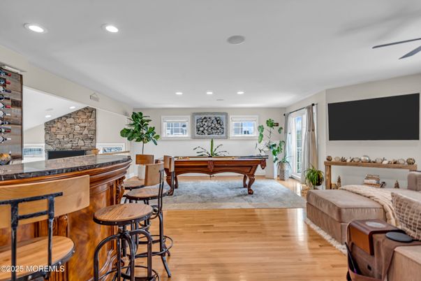 Billiard Table, Fireplace, Game Room, Interior, Recessed Lighting, Stone Walls, Wood Texture Flooring