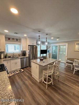 Dining room, Interior, Kitchen, Recessed Lighting, Stainless Steel Appliances, Wood Texture Flooring