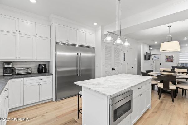 Dining room, Interior, Kitchen, Pendant Lights, Recessed Lighting, Stainless Steel Appliances, Wood Texture Flooring