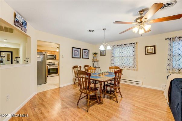 Dining room, Interior, Kitchen, Pendant Lights, Stainless Steel Appliances, Wood Texture Flooring