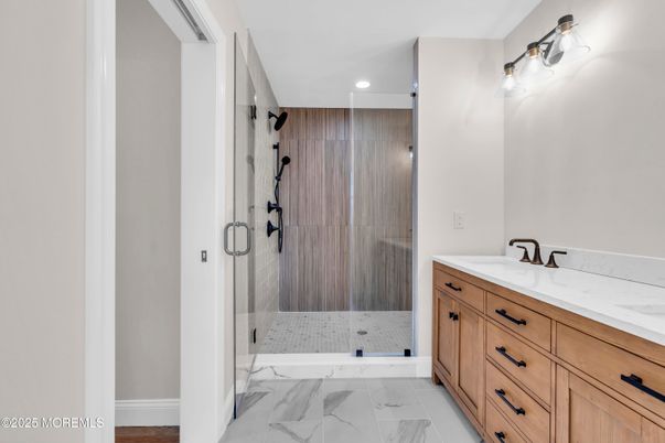 Bathroom, Dual Sink Vanities, Glass Shower, Interior, Marble, Recessed Lighting