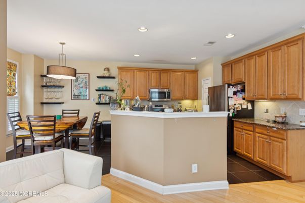 Dining room, Interior, Kitchen, Pendant Lights, Recessed Lighting, Stainless Steel Appliances, Wood Texture Flooring